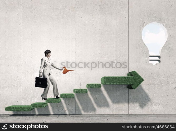 Invest right to get income. Young businesswoman watering green plant with can