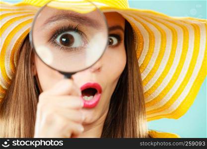 Investigation exploration education concept. Closeup woman face surprised expression, girl holding on eye magnifying glass loupe