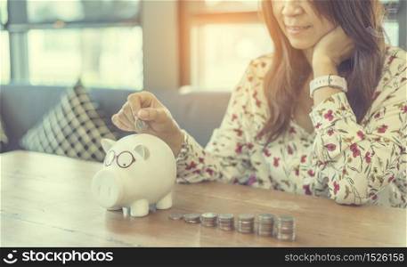 Investment Saving Money Concept. Woman hand go up on budget to buy house real estate agent. Gold coins stack symbol buy property mortgage money loan with stack of money coin