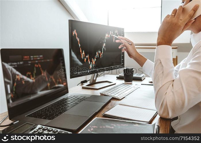Investment stock market Entrepreneur Business Man using Phone discussing and analysis finance market graph stock market trading,stock chart concept