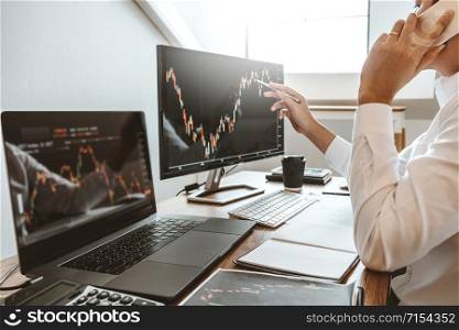 Investment stock market Entrepreneur Business Man using Phone discussing and analysis finance market graph stock market trading,stock chart concept