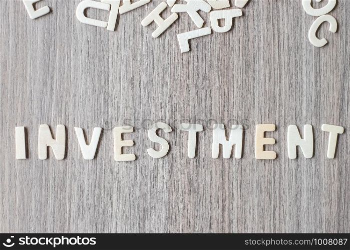 INVESTMENT word of wooden alphabet letters. Business and Idea concept