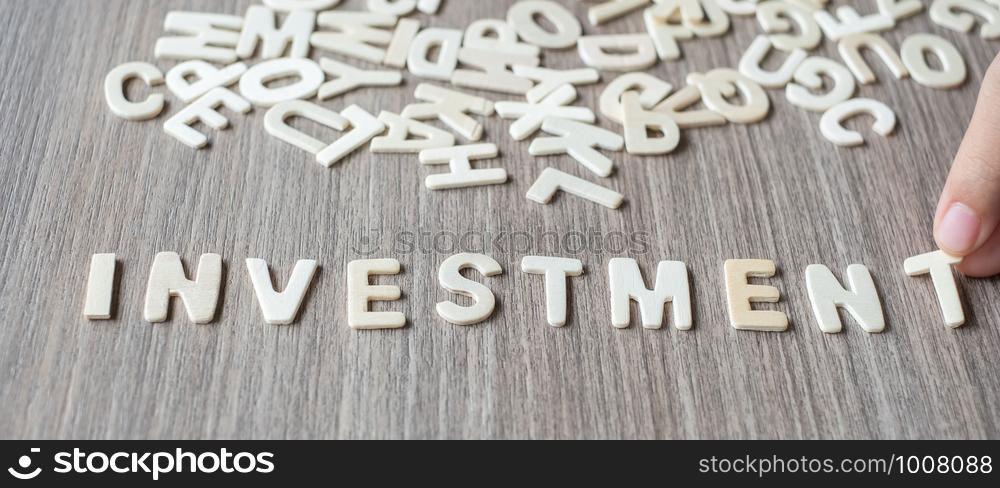 INVESTMENT word of wooden alphabet letters. Business and Idea concept