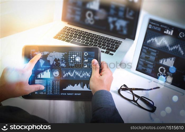 Investor analyzing stock market report and financial dashboard with business intelligence (BI), with key performance indicators (KPI).Man working new start up project in modern studio.Digital tablet laptop computer design.