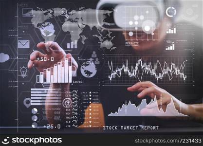 Investor analyzing stock market report and financial dashboard with business intelligence (BI), with key performance indicators (KPI).businessman wearing virtual reality goggles in modern office.