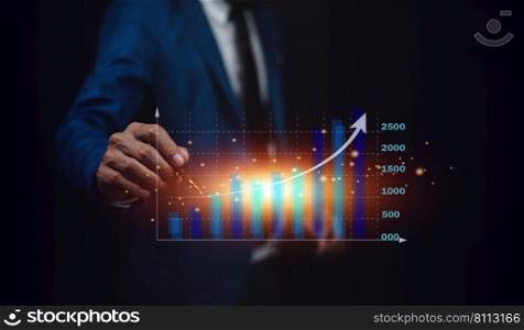 Investor or Trader holding digital graph on technology visual screen for trading online stock market forex or stock exchange