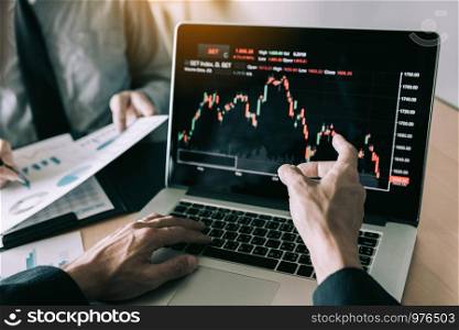Investors are pointing to laptops that have investment information stock markets and partners taking notes and analyzing performance data.