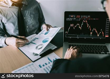 Investors pointed to the company operating results and then shared the results and recorded it in the notebook at the office.