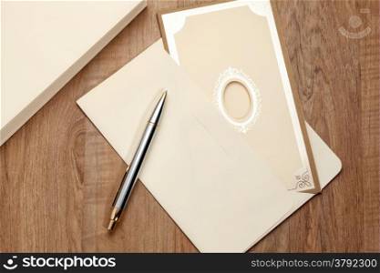 Invitation card and envelop on table
