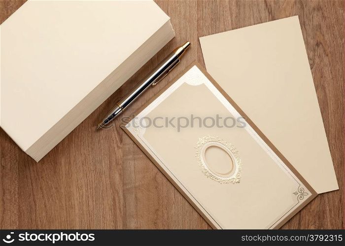 Invitation card with stack of blank envelop