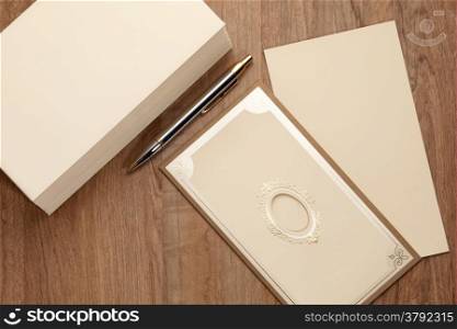Invitation card with stack of blank envelop