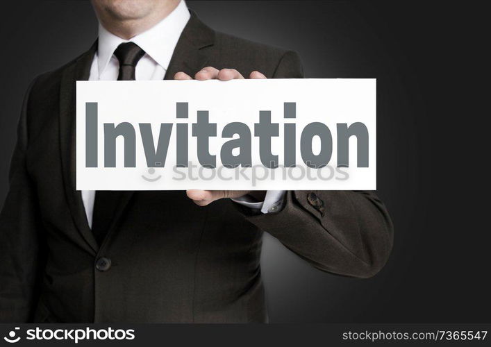 Invitation sign is held by businessman.. Invitation sign is held by businessman