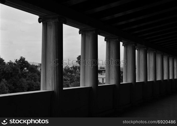 Ionic columns in stoa of attalos covered walkway in the ancient agora of Athens, Greece.