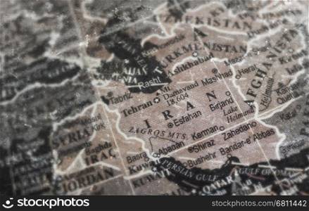Iran map on vintage crack paper background, selective focus