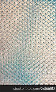 Iridescent holographic mermaid fish scales faux leather texture background.