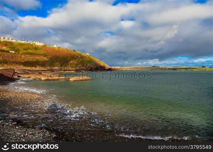 Irish landscape. Coastline atlantic ocean coast scenery cloudy blue sky, Church Bay County Cork, Ireland Europe