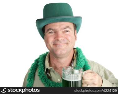 Irish man, a bit tipsy, smiling with his green beer on St. Patrick&rsquo;s Day. Isolated on white.