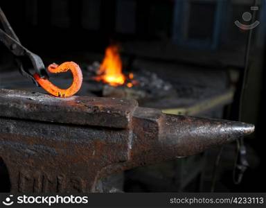iron element in the smithy on the iron anvil