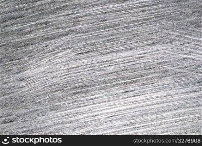 Iron plate full of scratch and light reflection, material background.