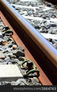 iron rusty train railway detail over dark stones rail way