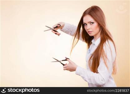 Irresponsibility danger haircut coiffure care beauty concept. Passionate female hairdresser. Cheerful lady dual wielding scissors showing her work tools normal and thinning shears. Passionate female hairdresser.