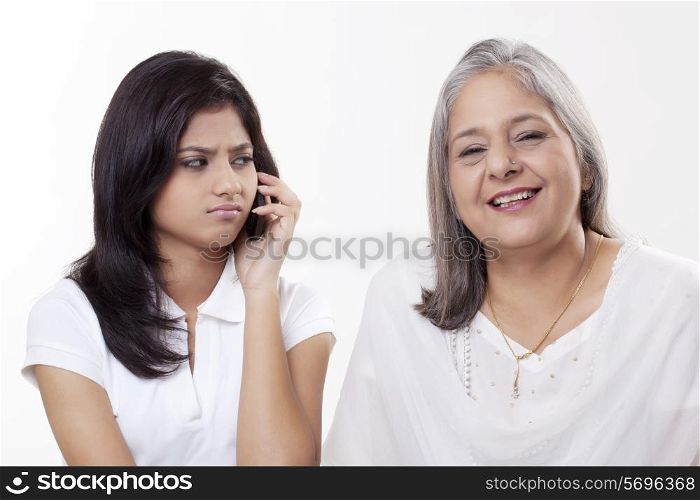 Irritated girl looking at her grandmother