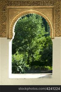 Islamic motifs arch window and green garden outside