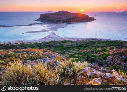 Island Gramvousa and the beautiful Balos beach on sunset in Crete island, Greece. Horizontal camera pan. Sunset over Balos beach in Crete, Greece.