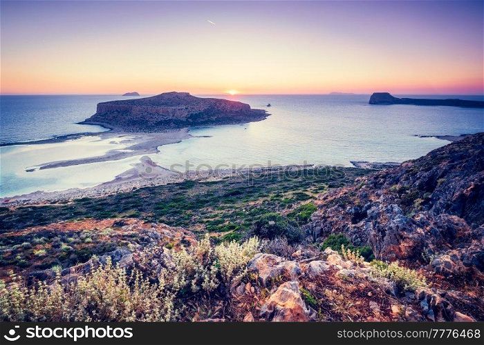 Island Gramvousa and the beautiful Balos beach on sunset in Crete island, Greece. Horizontal camera pan. Sunset over Balos beach in Crete, Greece.