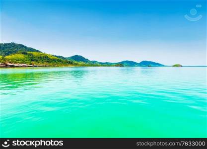 Island in blue sea, calm sea landscape with blue water