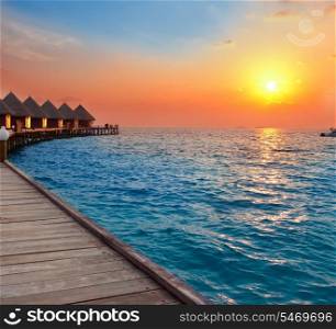 Island in ocean, Maldives. Sunset