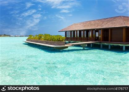 Island in ocean, overwater villa