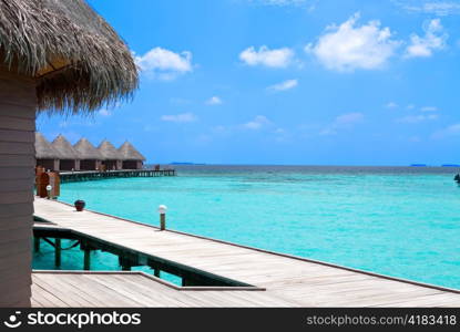 Island in ocean, overwater villas