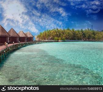 Island in ocean, overwater villas