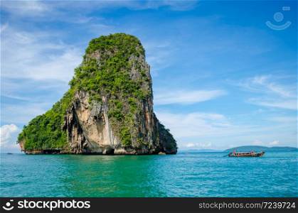island in sea with boat at Krabi, Thailand