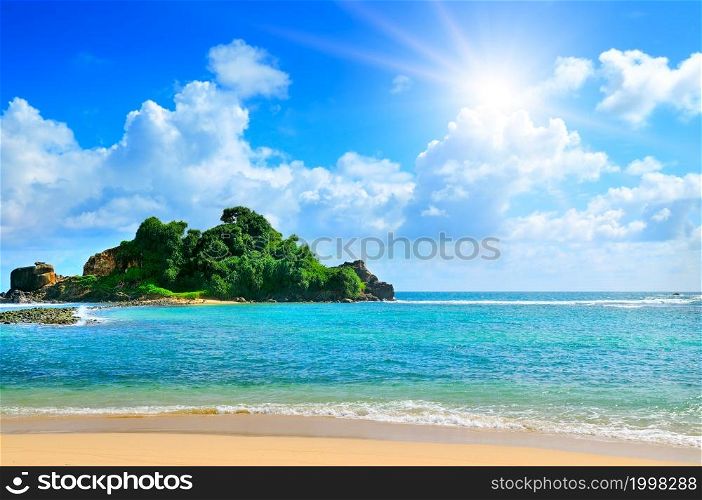 Island in the Indian Ocean, sandy beach and sun. Sri Lanka. The concept is travel and relaxation.