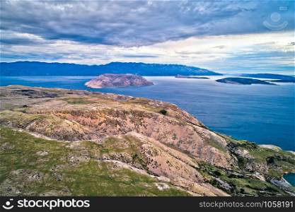 Island of Krk stone desert and Prvic island aerial view, layers of stone and sea, Kvarner bay of Croatia