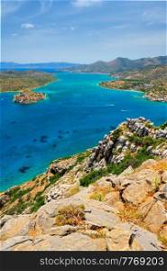Island of Spinalonga with old fortress former leper colony and the bay of Elounda, Crete island, Greece. Island of Spinalonga, Crete, Greece