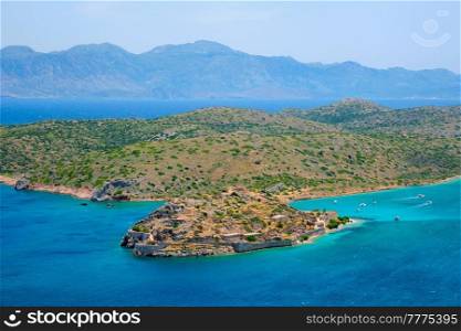 Island of Spinalonga with old fortress former leper colony and the bay of Elounda, Crete island, Greece. Island of Spinalonga, Crete, Greece