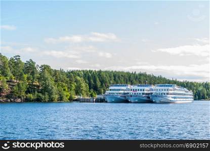Island Valaam, Russia - September 6, 2017: The view of the sea Bay with standing cruise ship in Valaam, Russia