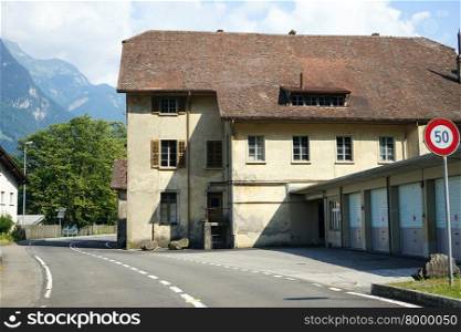 ISLETEN SCHIFF, SWITZERLAND ? CIRCA AUGUST 2015 Old building and highway