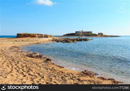 Isola delle Correnti and Capo Passero summer sandy sea beach (Portopalo, Siracusa, Sicilia, Italy), the most southern point in Sicily.