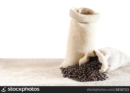 Isolated bags of coffee beans on the table.