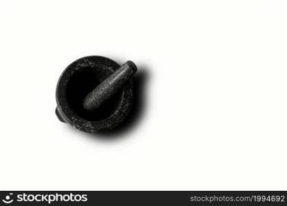 Isolated black mortar and pestle on white background . top up view , suitable for your design element.