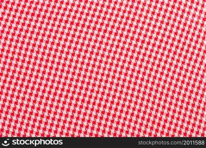 Isolated checkered tablecloth, red cloth close-up textile. The checkered tablecloth isolated