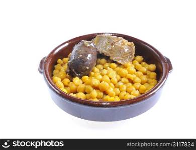 Isolated chickpeas in a clay pot with white background.