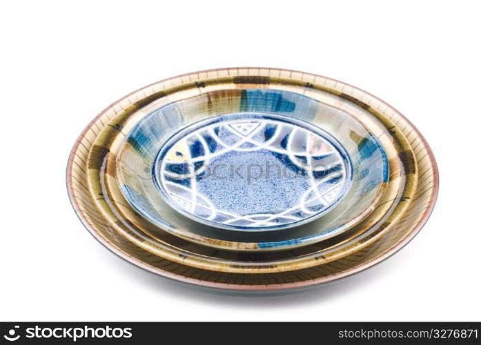 Isolated colorful pottery dish on white background, Chinese tranditional ware.