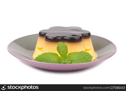 isolated Delicious egg pudding with mint in the dish, white background.