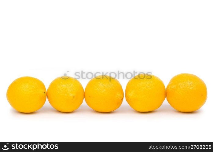 Isolated golden lemon in a row
