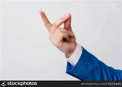 Isolated hand pointing with finger into copy space. Business concept with pointing finger.. Isolated hand pointing with finger into copy space. Business concept with pointing finger. Isolated hand above white background.